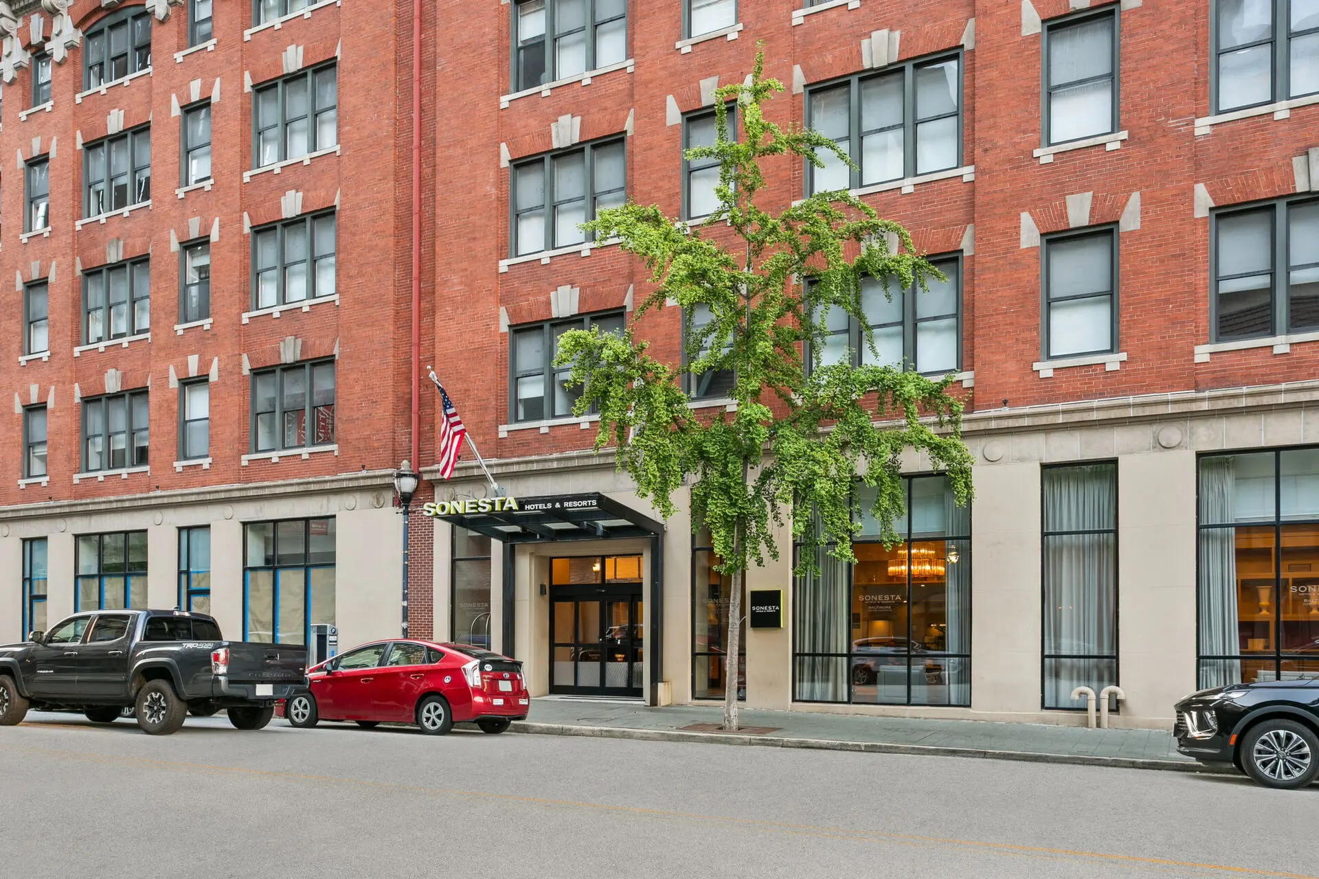 The exterior of the Sonesta Hotel Baltimore Inner Harbor on a sunny day